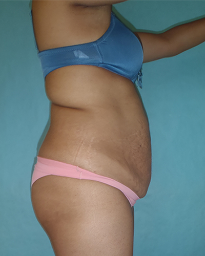 woman posing in front of water