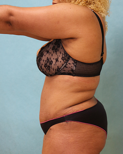 woman posing in front of water