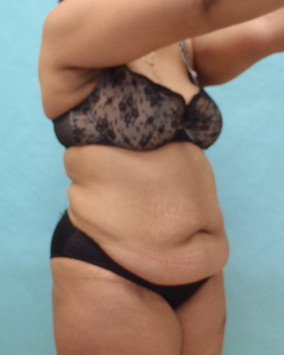 woman posing in front of water